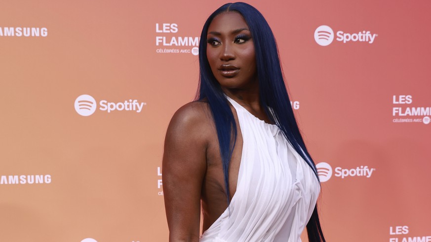 Singer Aya Nakamura poses before the Flammes awards Thursday, April 25, 2024 in Paris. Aya Nakamura is expected to perform during the opening ceremony of the Paris 2024 Olympic Games. (AP Photo/Aureli ...