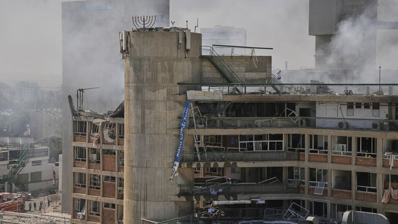 Smokes raises from a building of the Soroka hospital complex after it was hit by a missile fired from Iran in Be&#039;er Sheva, Israel, Thursday, June 19, 2025. (AP Photo/Leo Correa)
APTOPIX Israel Ir ...