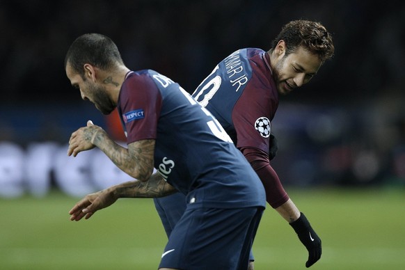 epa06344690 Dani Alves (L) of Paris Saint Germain celebrates with teammate Neymar (R) after scoring the 7-1 lead flanked by teammate Marquinhos (L) during the UEFA Champions League group B soccer matc ...