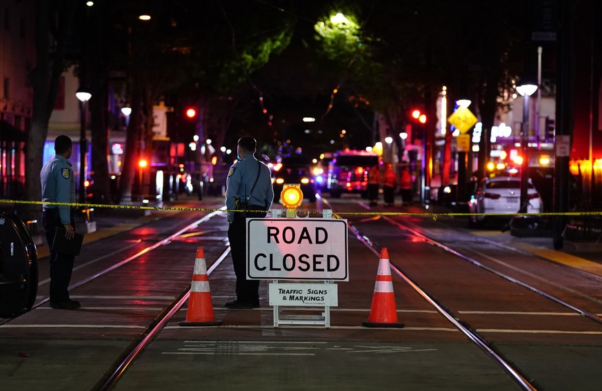 A roadblock is set a block away from the scene of an apparent mass shooting in Sacramento, Calif., Sunday, April 3, 2022. (AP Photo/Rich Pedroncelli)