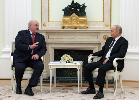 epa11273628 Russian President Vladimir Putin (R) speaks with Belarusian President Alexander Lukashenko during their meeting at the Kremlin in Moscow, Russia, 11 April 2024. EPA/GAVRIIL GRIGOROV/SPUTNI ...