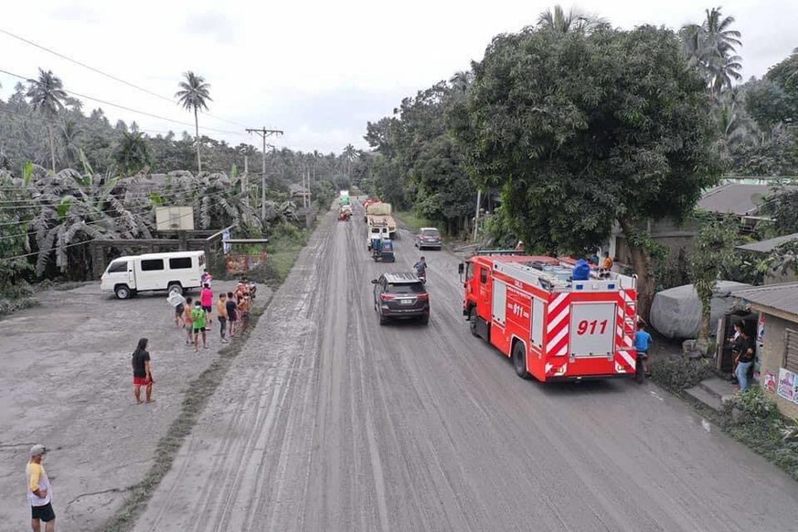 epa09997080 A handout photo taken with a drone and made available by the Sorsogon Provincial Information Office (SPIO) shows a village covered by volcanic ash from the eruption of Bulusan volcano in t ...