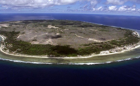 The barren and bankrupt island state of the Republic of Nauru awaits the arrival of 521 mainly Afghan refugees September 11, 2001 which have been refused entry into Australia. The 25 square kilometres ...