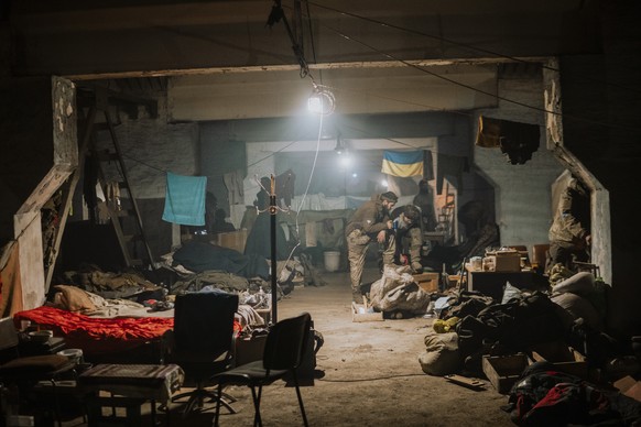 In this photo provided by Azov Special Forces Regiment of the Ukrainian National Guard Press Office, Ukrainian soldiers inside the ruined Azovstal steel plant in their shelter in Mariupol, Ukraine, Ma ...