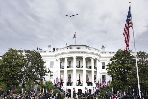 epa12919834 US fighter aircraft fly over the White House during a welcome ceremony hosted by US President Donald Trump for Britains King Charles III on the South Lawn of the White House in Washington ...
