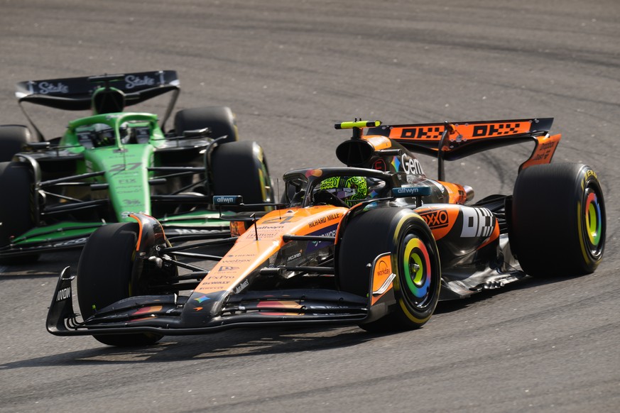 McLaren driver Lando Norris of Britain leads Kick Sauber driver Nico Hulkenberg of Germany during the sprint qualifying event for the Brazilian Formula One Grand Prix auto race at Interlagos race trac ...