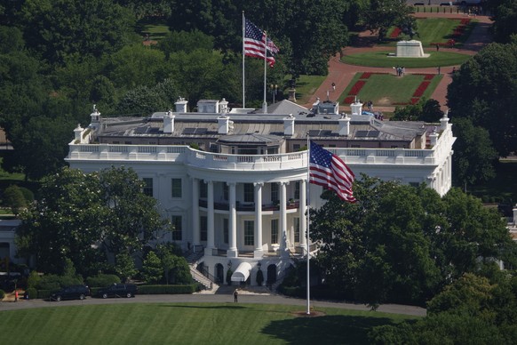 WASHINGTON, DC - JUNE 19: U.S. flags fly at the top of newly installed 100-foot-tall poles on the South and North Lawns of the White House on June 19, 2025 in Washington, DC. U.S. President Donald Tru ...