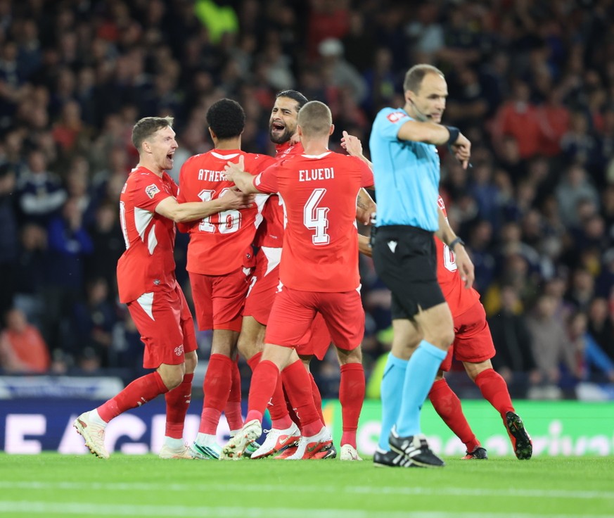 epa13271524 Ricardo Rodriguez of Switzerland, centre, celebrates after scoring the 0-1 during the UEFA Nations League match between Scotland and Switzerland in Glasgow, Britain, 29 September 2026. EPA ...