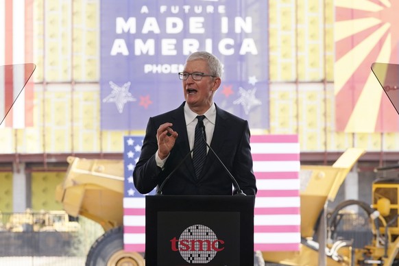 File - Apple CEO Tim Cook speaks at the Taiwan Semiconductor Manufacturing Company facility under construction in Phoenix, on Dec. 6, 2022. Multinational corporations are seeking to produce more items ...