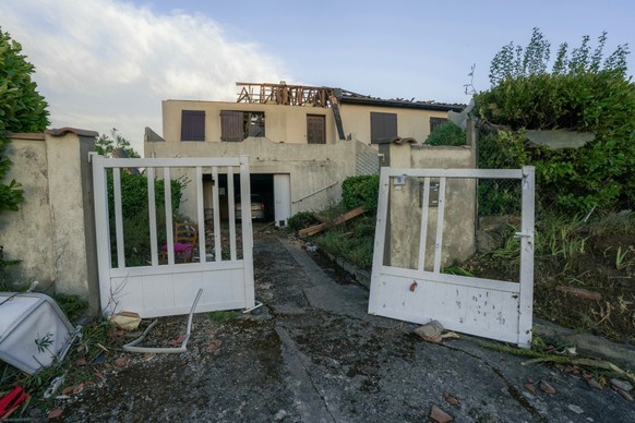 This photograph taken on August 24, 2026, shows damaged houses after a tornado struck Pomas, southwestern France. A tornado struck the Aude department on August 24 as part of southwestern France remai ...