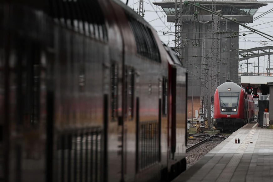 epa10543755 Trains at Munich Central Train Station one day prior the transportation strike in Munich, Germany, 26 March 2023. Deutsche Bahn announced that all long-distance trains in Germany will be c ...