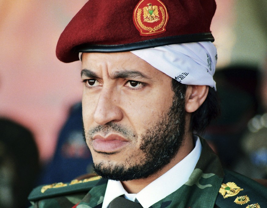 FILE - In this undated file photo made available on Sept. 25, 2011, al-Saadi Gadhafi, son of the late Libyan leader Moammar Gadhafi, watches a military exercise by the elite military unit commanded by ...