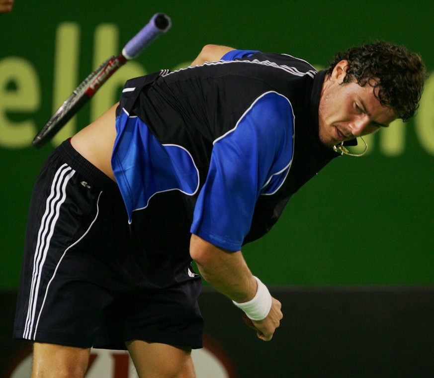 Marat Safin of Russia, fourth seed, throws a racket in frustration during his mens singles semifinal match against defending champion Roger Federer of Switzerland, top seed,at the Australian Open on R ...