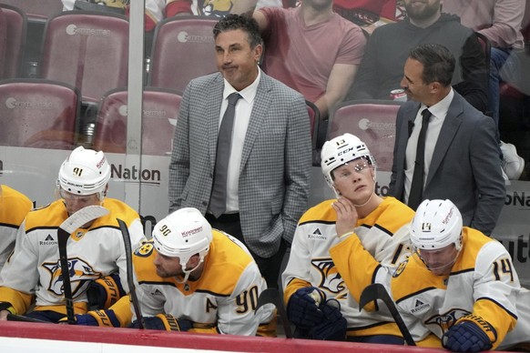 Nashville Predators head coach Andrew Brunette, left, rear, watches during the third period of an NHL hockey game against the Florida Panthers, Thursday, Nov. 7, 2024, in Sunrise, Fla. (AP Photo/Lynne ...