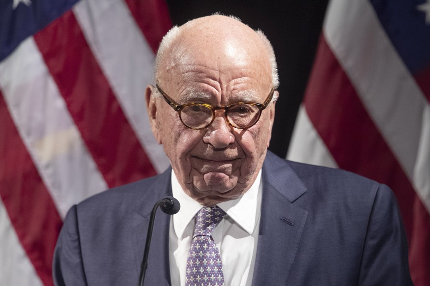 FILE - Rupert Murdoch introduces Secretary of State Mike Pompeo during the Herman Kahn Award Gala, Oct. 30, 2019, in New York. Documents in defamation lawsuit illustrate pressures faced by Fox News jo ...