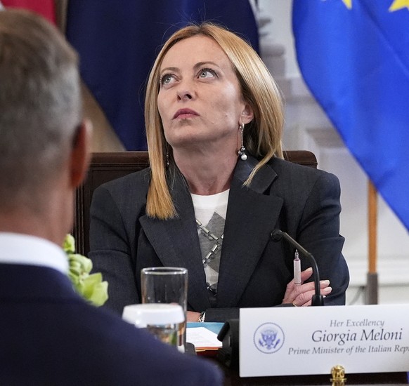 Italy&#039;s Prime Minister Giorgia Meloni, left, and Germany&#039;s Chancellor Friedrich Merz, right, listen during a meeting with President Donald Trump, Ukrainian President Volodymyr Zelenskyy and  ...