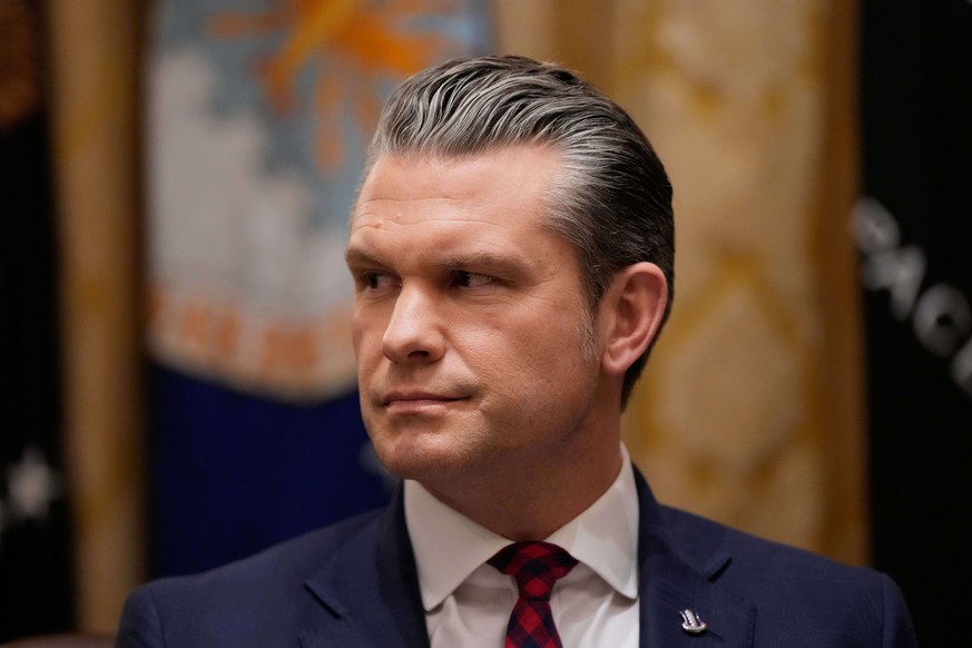 Defense Secretary Pete Hegseth listens as President Donald Trump speaks during a cabinet meeting at the White House, Tuesday, Dec. 2, 2025, in Washington. (AP Photo/Julia Demaree Nikhinson)
Pete Hegse ...
