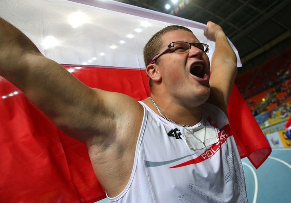 MOSCOW, RUSSIA - AUGUST 12: Pawel Fajdek of Poland celebrates winning gold in the Men&#039;s Hammer final during Day Three of the 14th IAAF World Athletics Championships Moscow 2013 at Luzhniki Stadiu ...