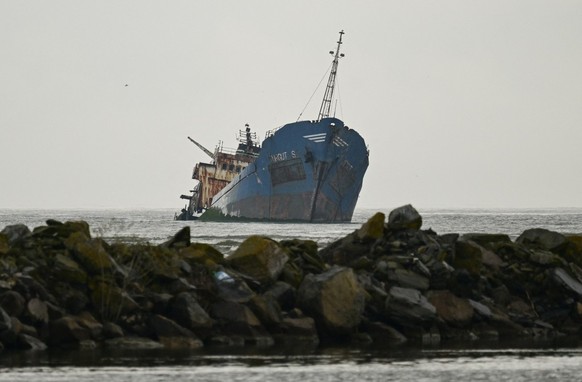 The rusting hull of the cargo ship Turgut S (also known as Turgut Usta) lies partially submerged in the shallow waters of Musura Bay, near the Black Sea port of Sulina, eastern Romania, on May 10, 202 ...