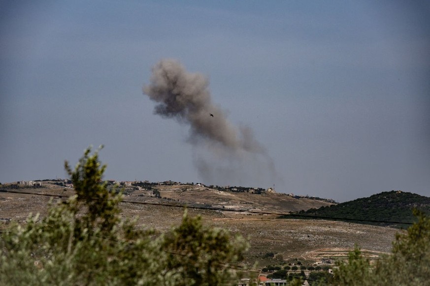 RMAICH, LEBANON - MAY 19: Smoke rises above the village of Maroun al-Ras, from an Israeli strike against a Hezbollah target, which the Iran-backed Shiite group says killed at least two of its members, ...