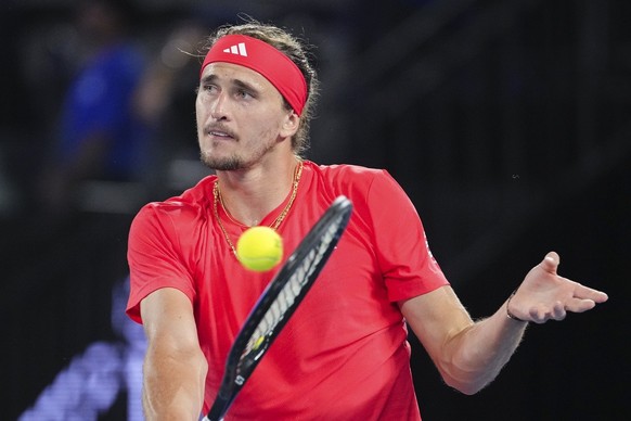 Germany&#039;s Alexander Zverev plays a backhand return to Serbia&#039;s Novak Djokovic and during an exhibition match ahead of the Australian Open tennis championship in Melbourne, Australia, Thursda ...