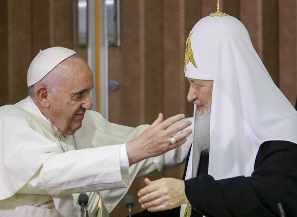 FILE ��� Pope Francis, left, reaches to embrace Russian Orthodox Patriarch Kirill after signing a joint declaration at the Jose Marti International airport in Havana, Cuba o Feb. 12, 2016. The Vatican ...
