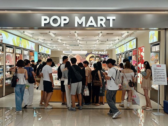 CHONGQING, CHINA - AUGUST 28 2025: People shop in an outlet of Pop Mart, the vendor of the popular toy Labubu, in southwest China&#039;s Chongqing Municipality Thursday, Aug. 28, 2025. (Photo credit s ...