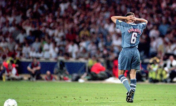 England&#039;s Gareth Southgate walks away holding his head after failing to score in the penalty shootout against Germany which ended England&#039;s chances in the Euro 96 soccer semi-final. Germany  ...