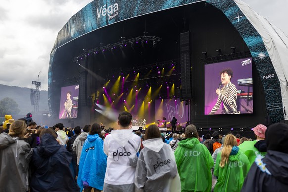 epa12266473 Festival goers cheer as Swiss singer Nemo performs performing on the Vega stage, during the 48th edition of the Paleo Festival, in Nyon, Switzerland, 27 July 2025. The Paleo is an open-air ...