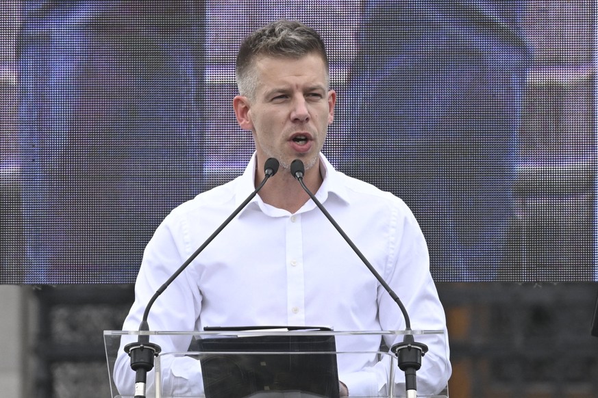 epa11262962 Hungarian lawyer Peter Magyar delivers a speech during an anti-government demonstration announced by him in front of the Parliament building at Kossuth square in Budapest, Hungary, 06 Apri ...