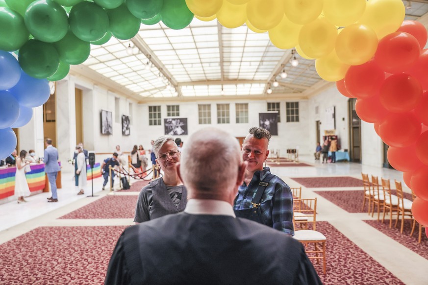 Danni Fox, 48, left, and Jak Kazmarek, 46, get married at City Hall during a special Pride celebration on Friday, June 24, 2022, in San Francisco. (Gabrielle Lurie/San Francisco Chronicle via AP)