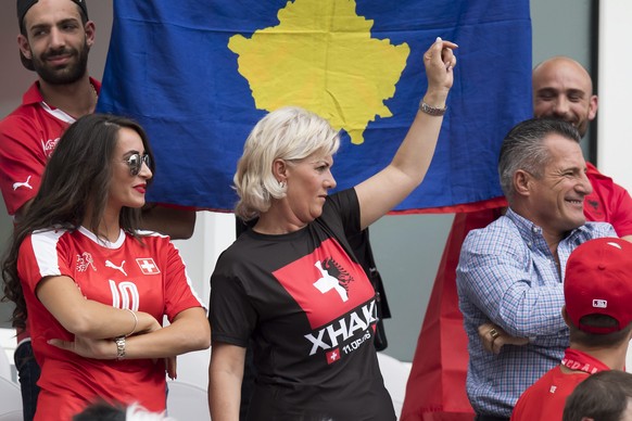 epa05357534 Leonita Lekaj (l), the girlfriend of Swiss midfielder Granit Xhaka, cheers the parents father Ragip Xhaka (R) and mother Elmaze Xhaka of the soccer player during the UEFA EURO 2016 group A ...