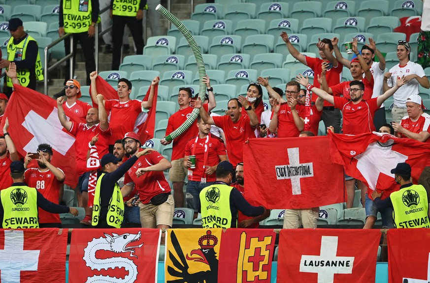 epa09289201 Supporters of Switzerland react after the UEFA EURO 2020 group A preliminary round soccer match between Switzerland and Turkey in Baku, Azerbaijan, 20 June 2021. EPA/Ozan Kose / POOL (REST ...