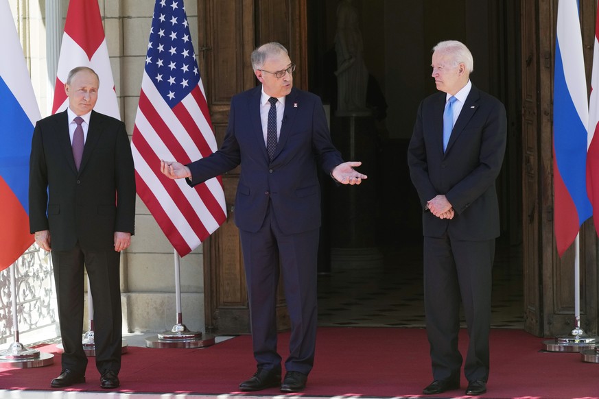From left: Russian President Vladimir Putin, Swiss President Guy Parmelin, U.S President Joe Biden pose for media at the entrance of the 'Villa la Grange' in Geneva, Switzerland in Geneva, S ...
