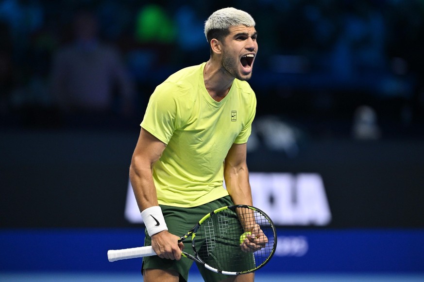 epa12524435 Carlos Alcaraz of Spain celebrates winning against Lorenzo Musetti of Italy after their Men&#039;s Singles Round Robin tennis match at the ATP Finals in Turin, Italy, 13 November 2025. EPA ...