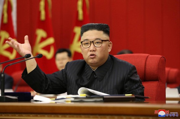 epa09275006 A photo released by the official North Korean Central News Agency (KCNA) shows North Korean Supreme Leader Kim Jong-un presiding over the opening of the third Plenary Meeting of the 8th Ce ...