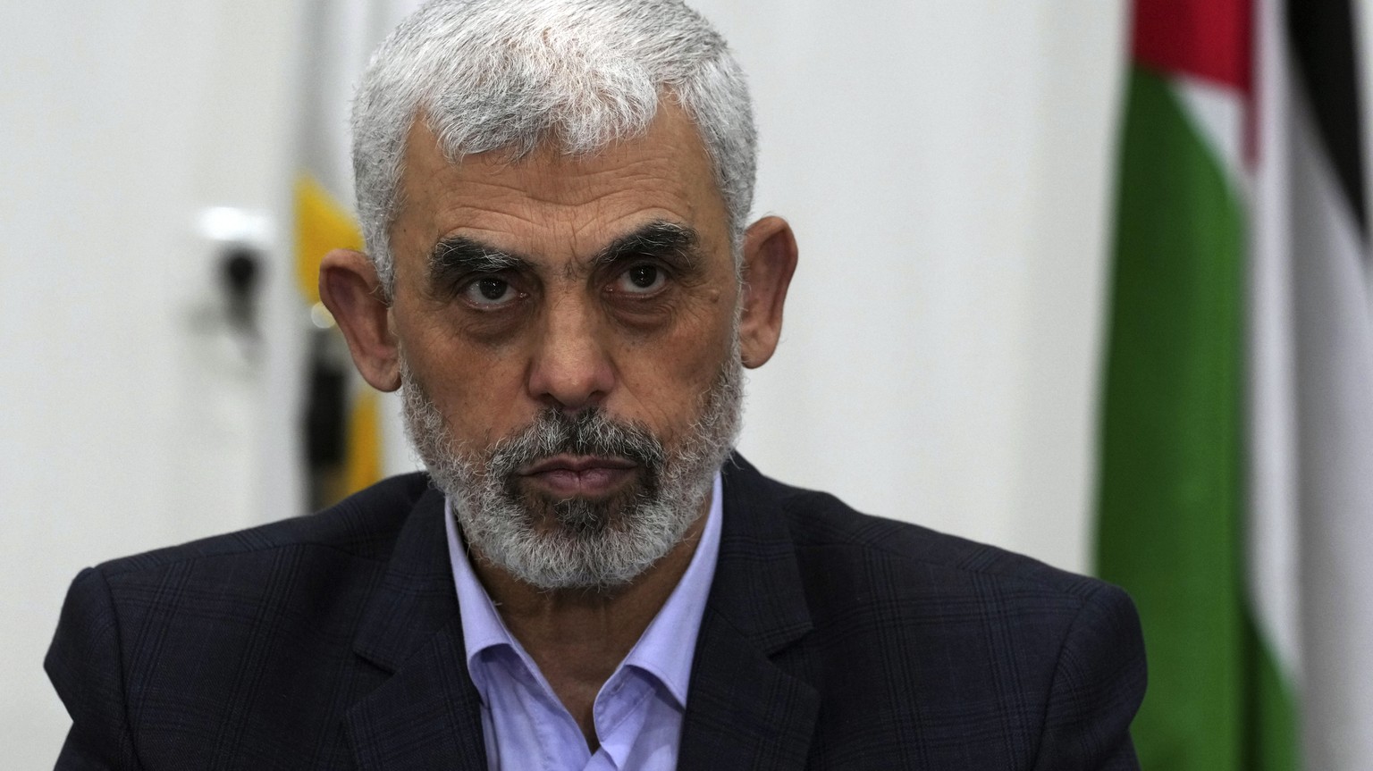 FILE - Yahya Sinwar, head of Hamas in Gaza, chairs a meeting with leaders of Palestinian factions at his office in Gaza City, Wednesday, April 13, 2022. The Hamas officials are accused by the ICC of p ...