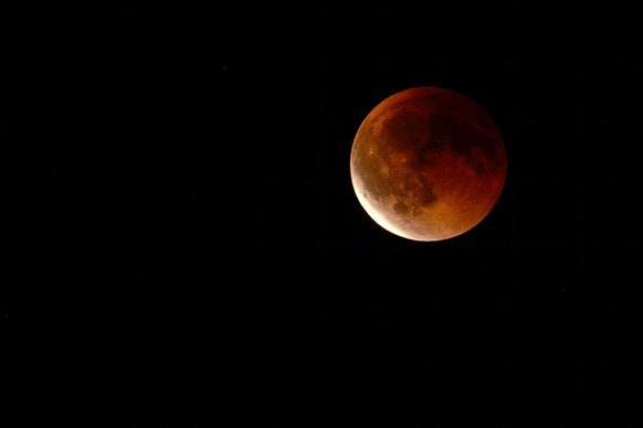 A lunar eclipse on the Blood Moon as seen from Orpund, Switzerland, Sunday, September 7, 2025. (KEYSTONE/Julie Lovens)