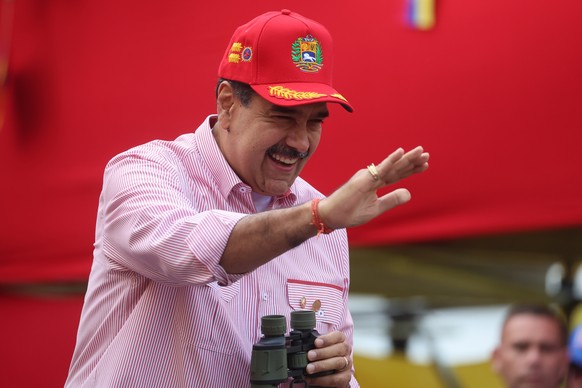 epa12563445 Venezuelan President Nicolas Maduro waves during a rally in Caracas, Venezuela, 01 December 2025. Chavistas said they seek peace but are prepared to &#039;defend the homeland&#039; during  ...