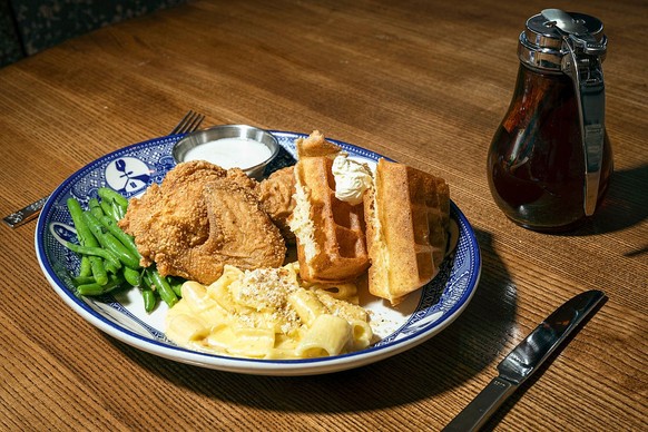 WASHINGTON, DC - AUGUST 29: 
&quot;Southern Fried Chicken &amp; Waffle&quot;

Fried chicken and a waffle, served with a side of a seven cheese macaroni, green beans, and maple syrup at Founding Farmer ...