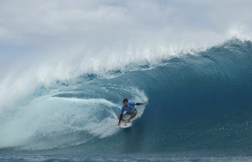 Jack Robinson, of Australia, gets a barrel in the gold medal final in the surfing competition during the Paris 2024 Olympic Games in Teahupo&#039;o, Tahiti, Monday, Aug. 5, 2024. (Ben Thouard/Pool Pho ...