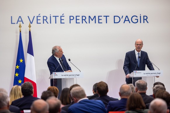 epa12032808 French Prime Minister Francois Bayrou (L) and Finance Minister Eric Lombard (R) speak during a press conference to present the budget guidelines in Paris, France, 15 April 2025. EPA/CHRIST ...