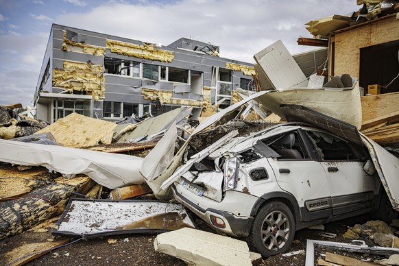 An industrial building and a car were damaged when a tornado storm sweept through the city of La Chaux-de-Fonds, Switzerland, Monday, July 24, 2023. A storm swept across part of the canton of Neuchate ...