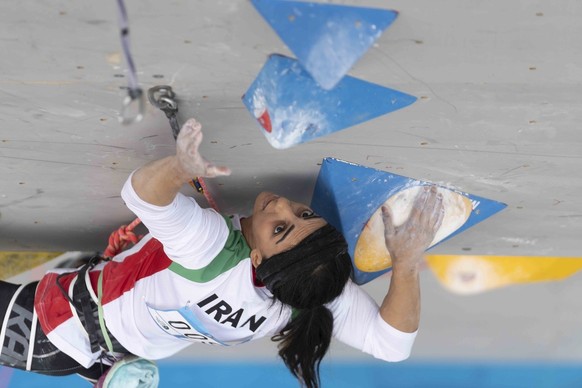 epa10250882 A handout photo made available by the International Federation of Sport Climbing (IFSC) shows Iranian climber Elnaz Rekabi competing during the women&#039;s Boulder &amp; Lead finals of th ...