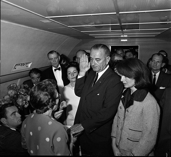In the aftermath of the assasination of US President John F. Kennedy, American politician and Vice-President Lyndon Baines Johnson (1908 - 1973) takes the oath of office to become the 36th President o ...