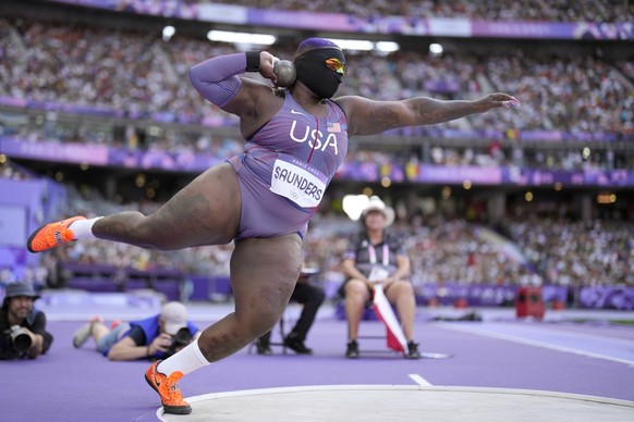 Raven Saunders, of the United States, competes during the women&#039;s shot put qualification at the 2024 Summer Olympics, Thursday, Aug. 8, 2024, in Saint-Denis, France. (AP Photo/Bernat Armangue)