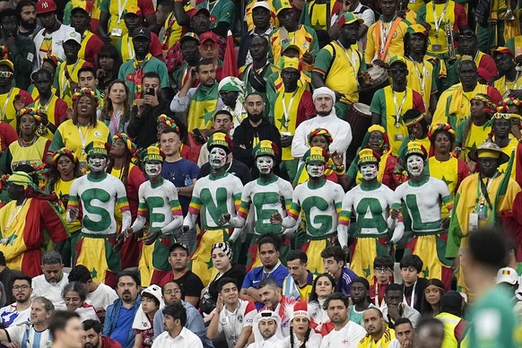 Senegal&#039;s supporters watching their team from the tribune during the World Cup round of 16 soccer match between England and Senegal, at the Al Bayt Stadium in Al Khor, Qatar, Sunday, Dec. 4, 2022 ...