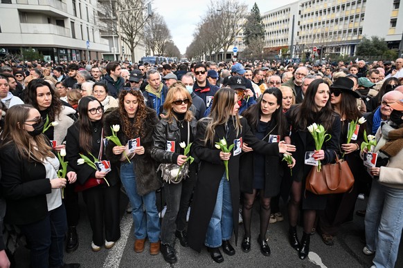 epa12765298 Activists gather near Place Jean Jaures in Lyon, France, 21 February 2026, during a march in tribute to late far-right sympathiser Quentin Debranque. 23-year-old student Quentin Debranque  ...