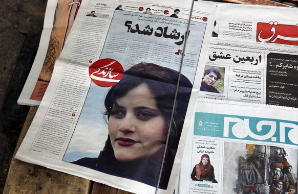 epa10191412 Iranian daily newspapers reporting Mahsa Amini���s death, in Tehran, Iran, 18 September 2022. Mahsa Amini, a 22 year old girl, was detained on 13 September by the police unit responsible f ...