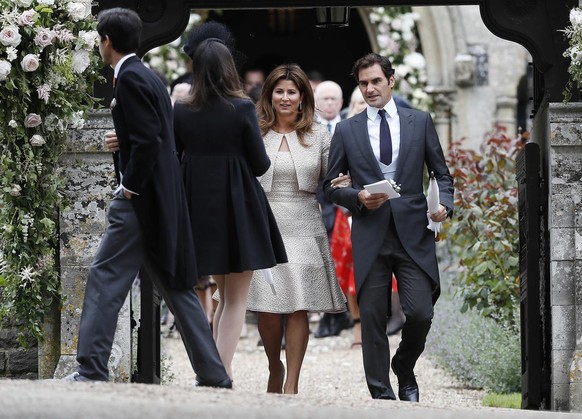 Roger Federer and his wife Mirka leave after the wedding of Pippa Middleton and James Matthews at St Mark&#039;s Church in Englefield, England Saturday, May 20, 2017. Middleton, the sister of Kate, Du ...